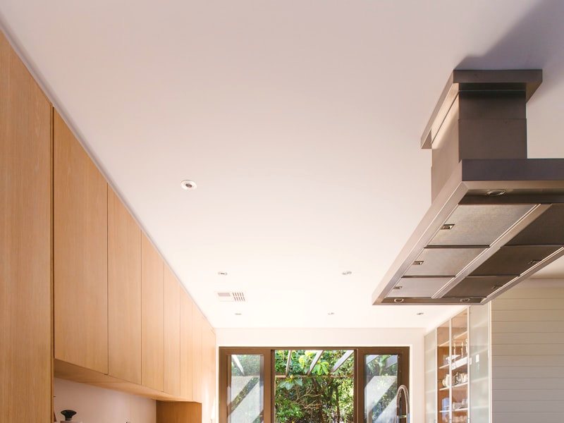 A smooth refinished ceiling with recessed lighting